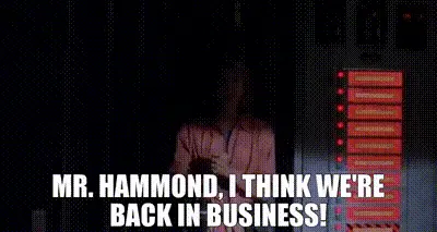 Ellie Sattler celebrates after restoring power to Jurassic Park, saying, 'Mr Hammond, I think we're back in business!'